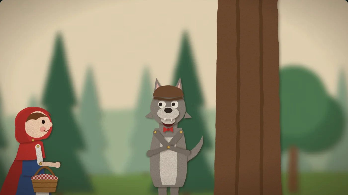 Little Red Riding Hood meets the wolf in the woods: two paper puppets with brass pins at their joints.