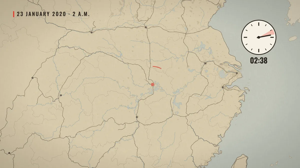 Railway lines leaving Wuhan on the paper map, with a clock at 2:38 a.m. on 23 January 2020.